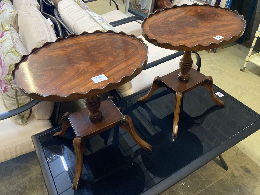 A pair of Regency style mahogany oval galleried wine tables, width 45cm, depth 37cm, height 47cm